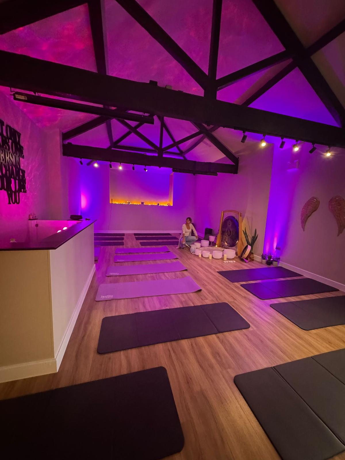 a sound bath with yoga mats and no people