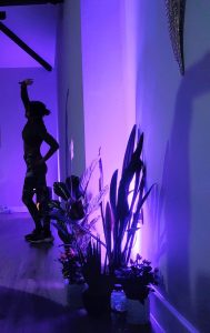 blue light and a woman with a gong