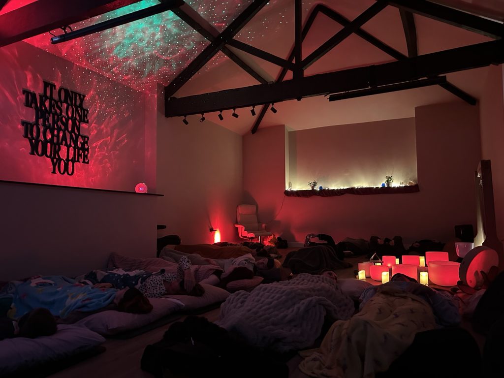 a soundbath in a colourful room