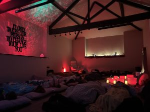 a soundbath in a colourful room