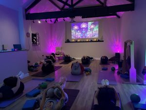 a soundbath in a colourful room